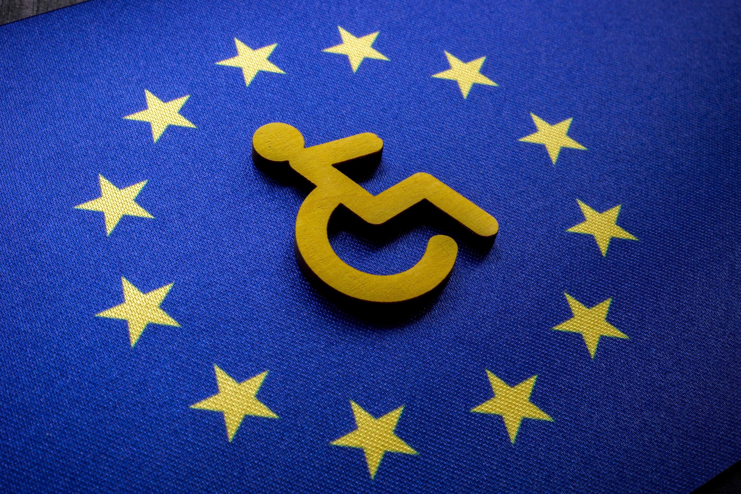 The European flag, with the International Symbol of Access in the middle